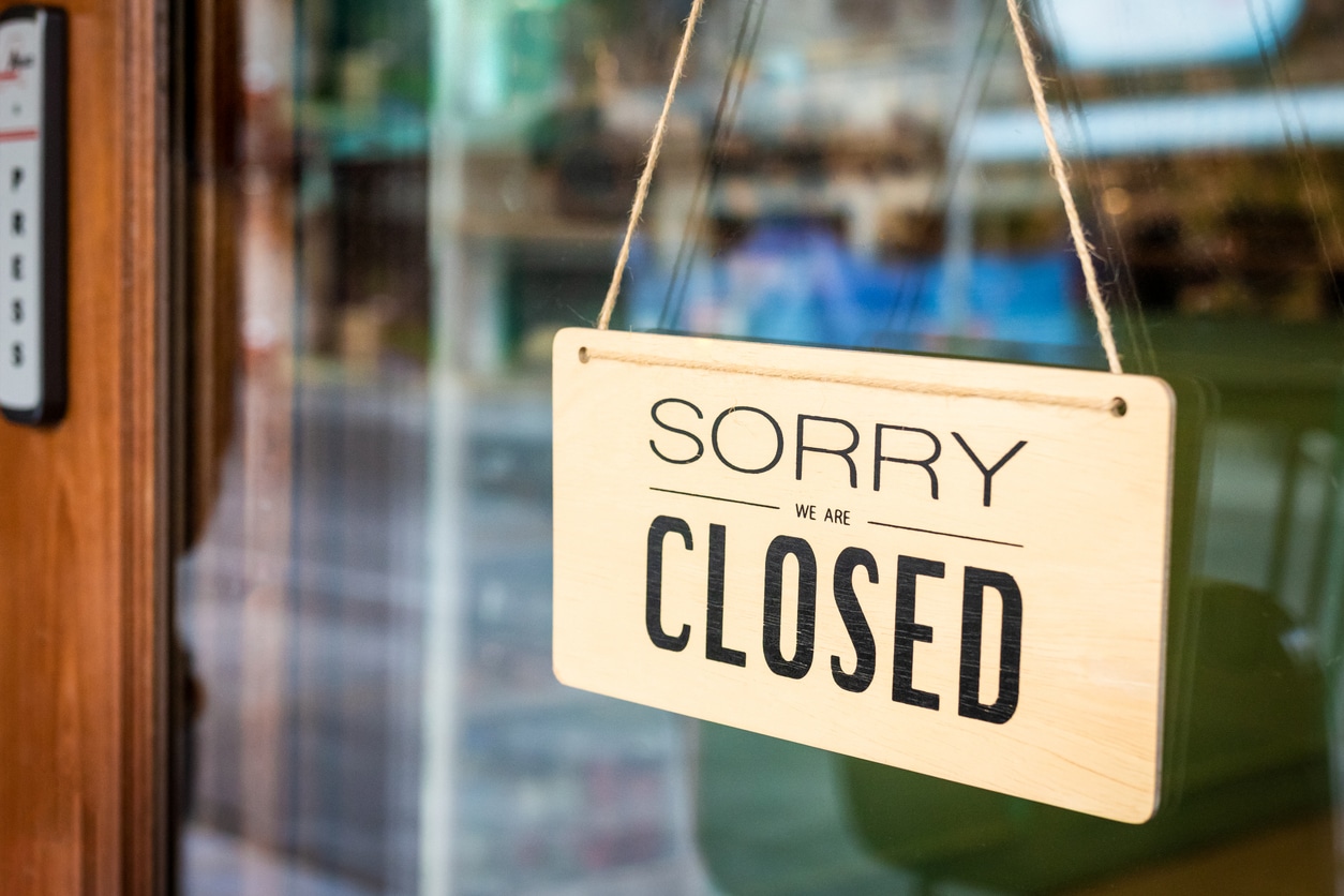 “Sorry We Are Closed” sign on the door of an Indiana business